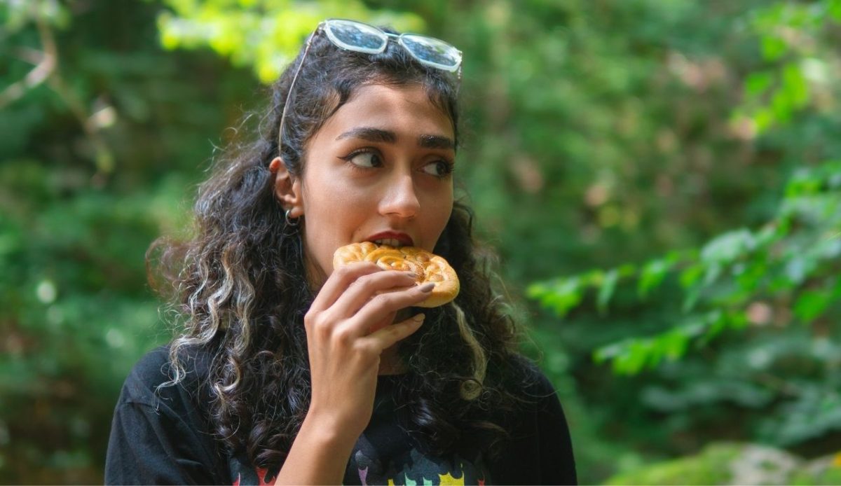 a woman is eating snacks                  