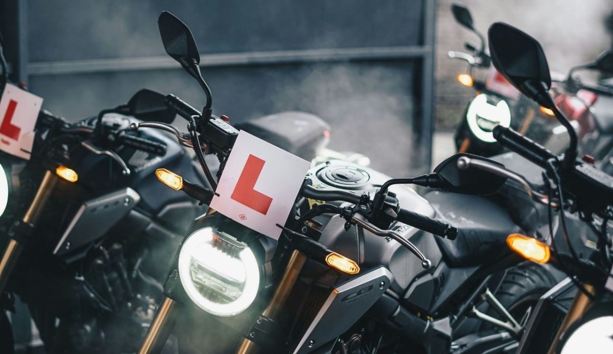 motorbike with headlight on at daytime                           