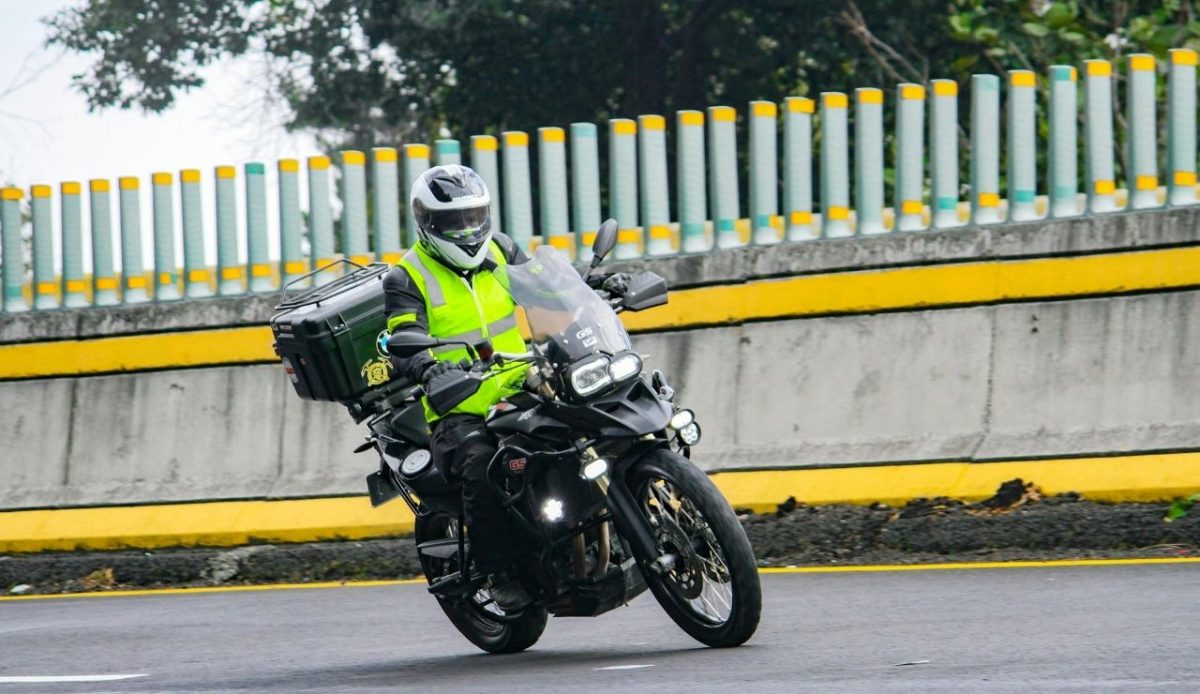 motorcyclist wearing high-visibility vest                              
