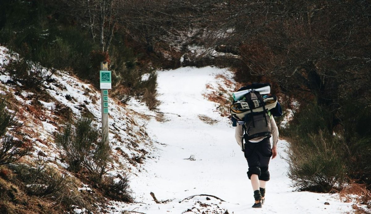 12 Seasonal Hiking Goals to Make 2026 Your Best Outdoor Year Yet 2 person in hiking kit walking on a track