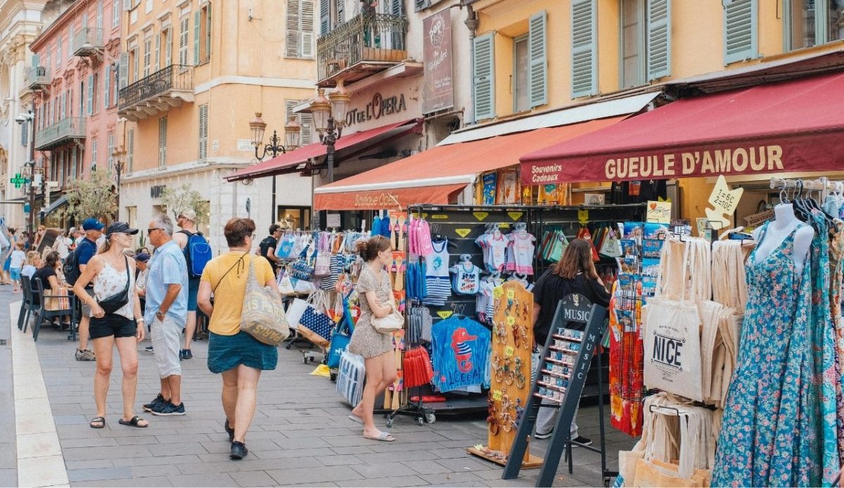travelers at busy street with open bag                         