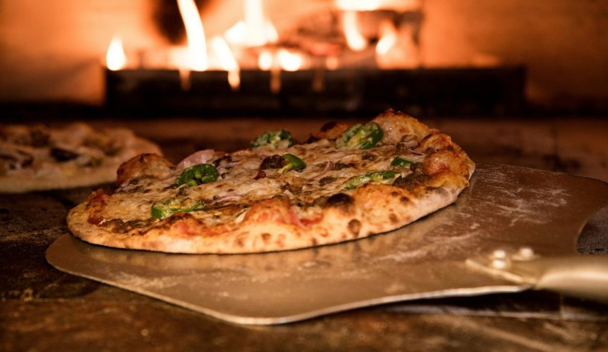 Baked Pizza on Pizza Peel in Oven,    