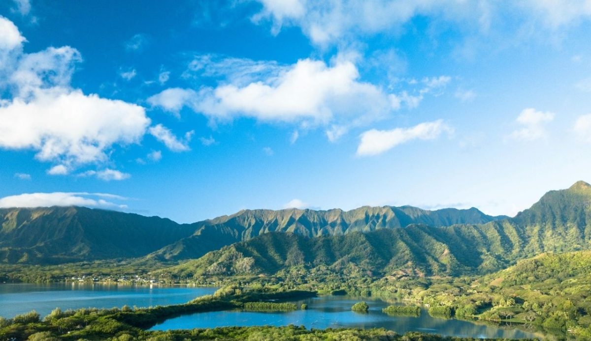 12 Hawaii Beaches Too Crowded to Enjoy 7 Aerial view of Hanalei Bay and lush green mountains in Kauai, Hawaii