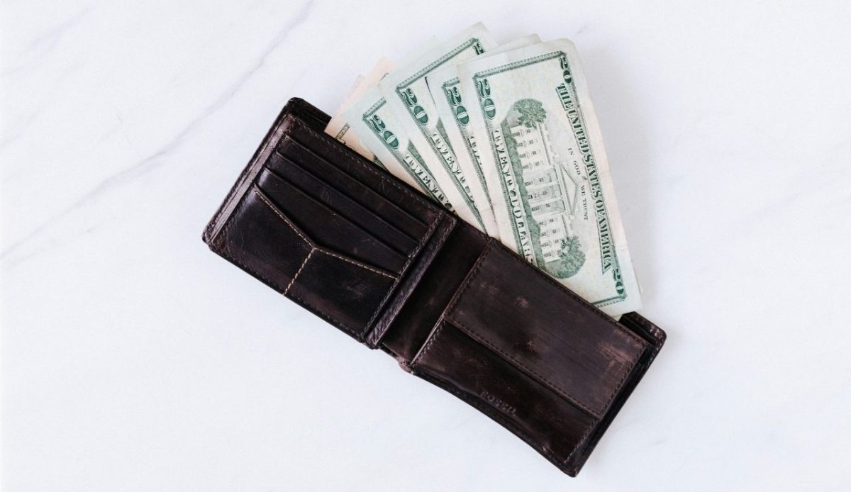 Brown wallet with US dollar cash inside, 