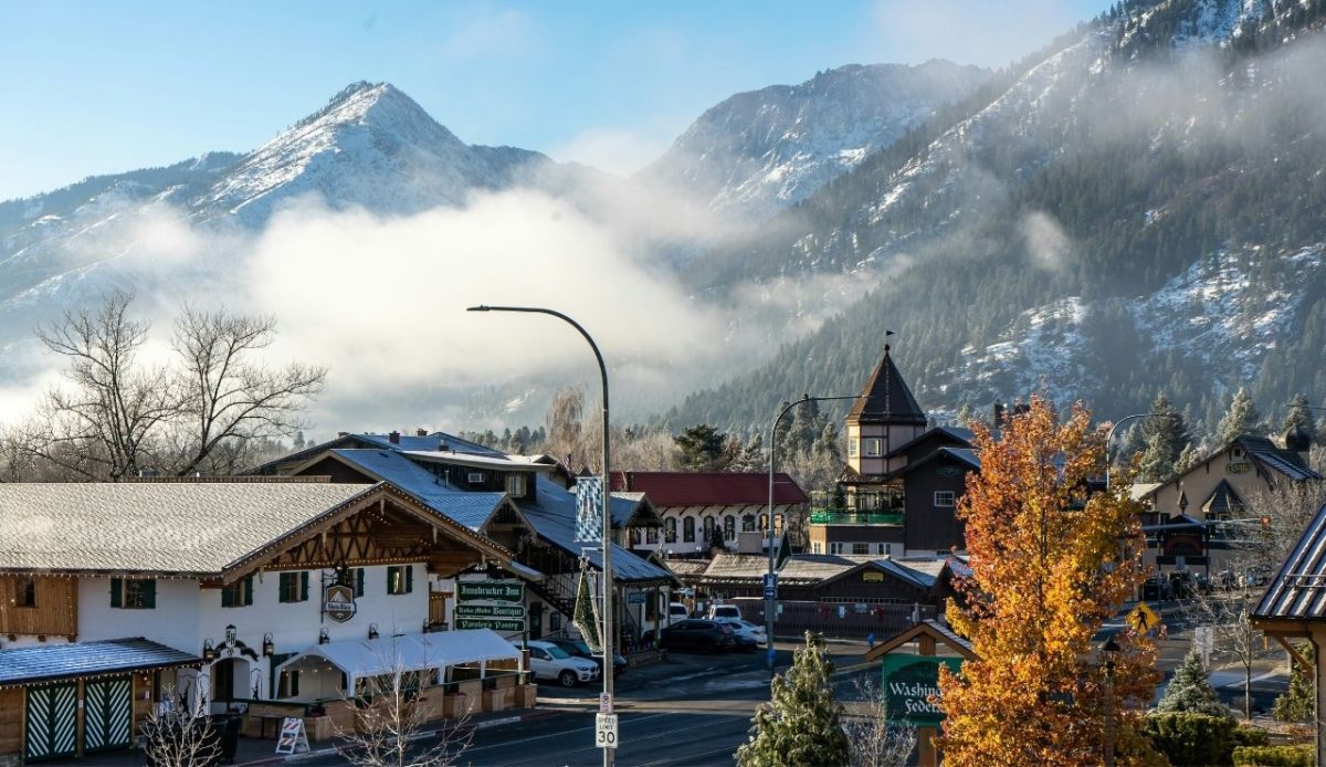 12 Heritage Towns in America Locals Say Are Turning Into Theme Parks 9 Leavenworth, Washington with alpine-style buildings and mountain backdrop