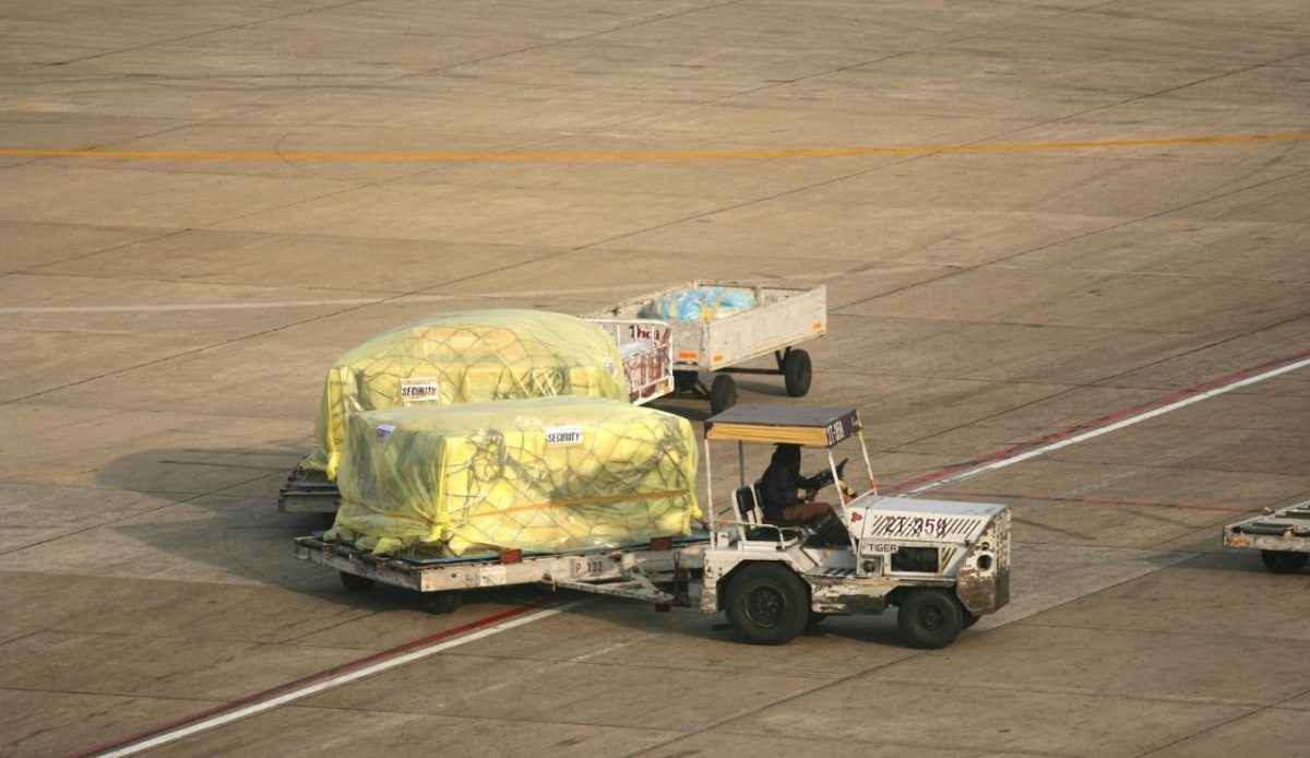 Man Driving supply Vehicle with at Airport                                     