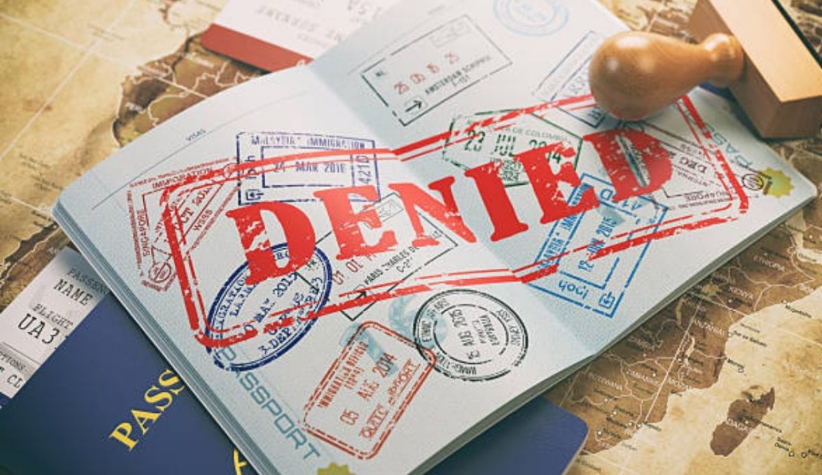 Passport with denied visa stamp on it     