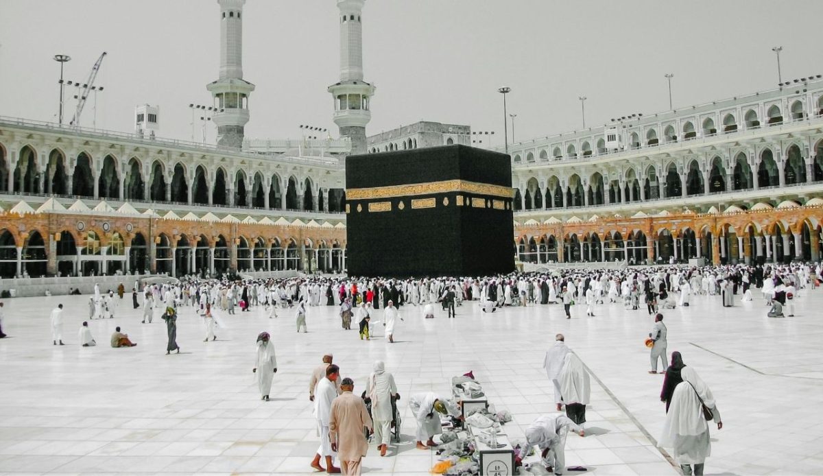 Pilgrims gathered around the Kaaba at the Grand Mosque in Mecca, representing religious pilgrimage travel and visa-related concerns                             