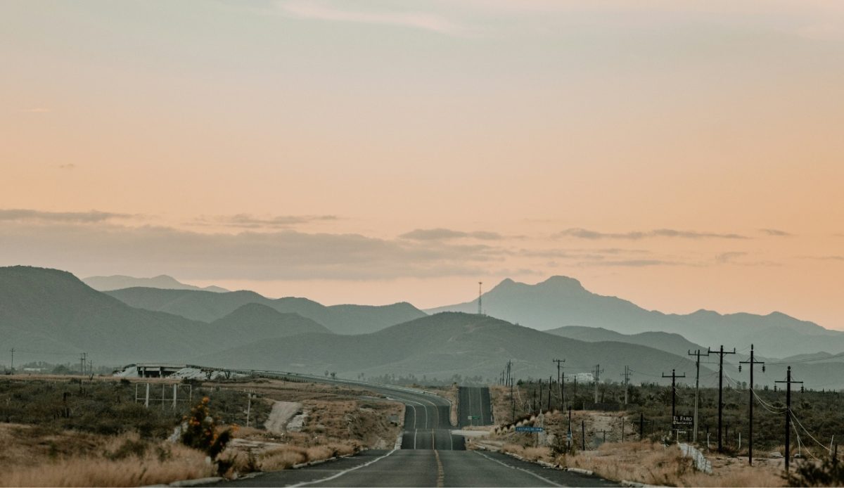 Scenic view of a road leading through mountainous terrain in El Fuerte, Sinaloa, at sunset 