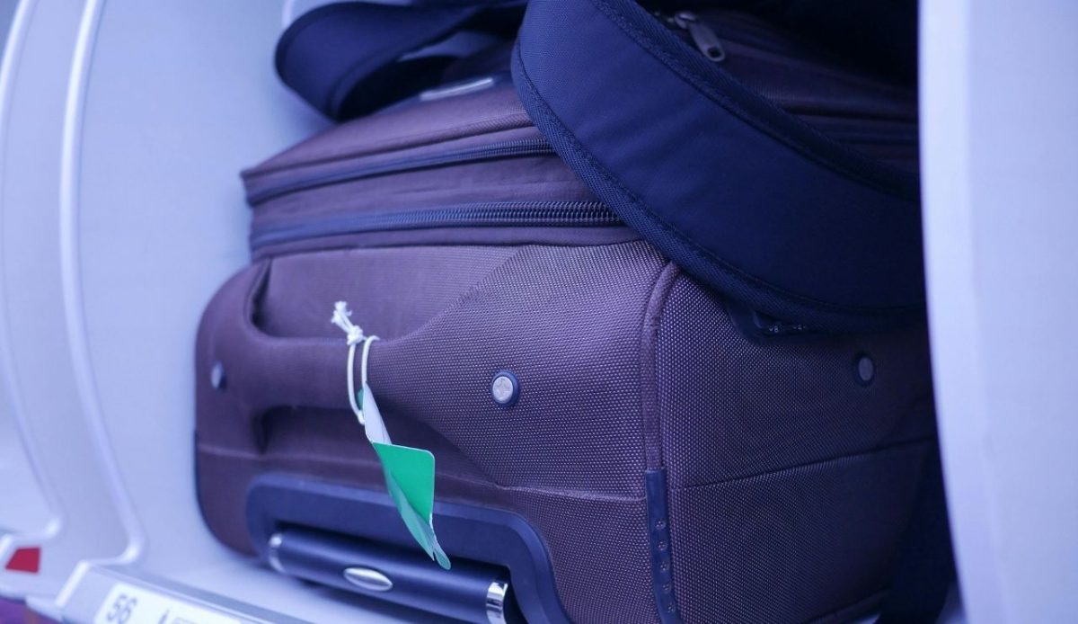 oversized carry-on luggage in an airplane 