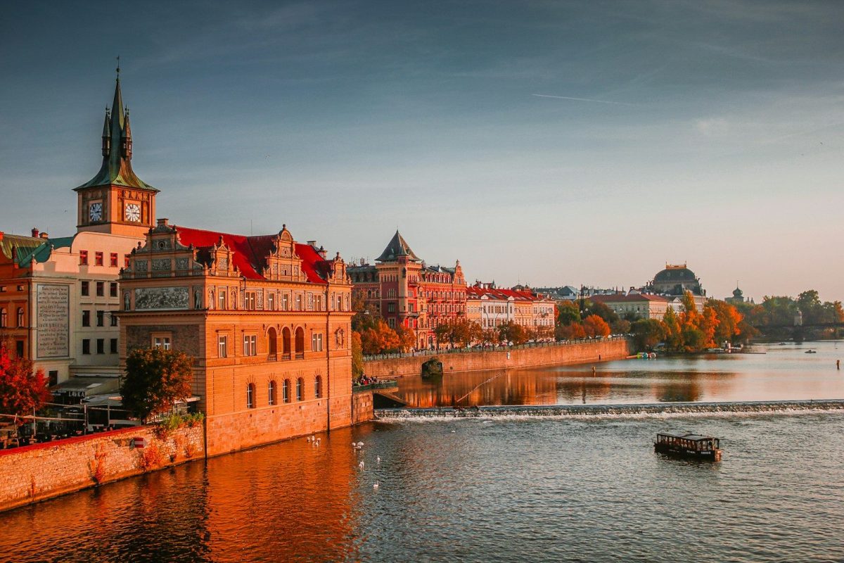 9 European Cities Perfect for Your First Trip Abroad 3 photo of boat on body of water near high-rise buildings