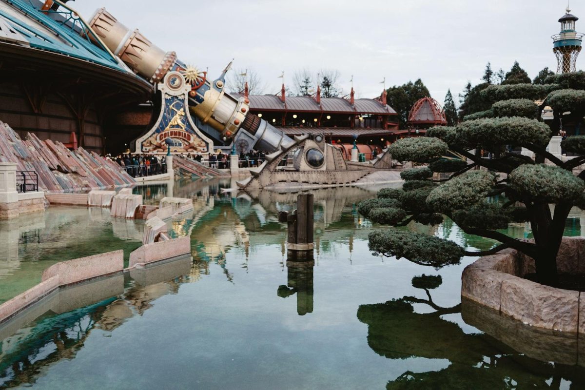 Reflective pond with a futuristic attraction at a theme park in Coupvray, France.
