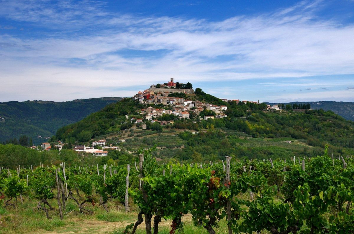 a hill with a village on top of it