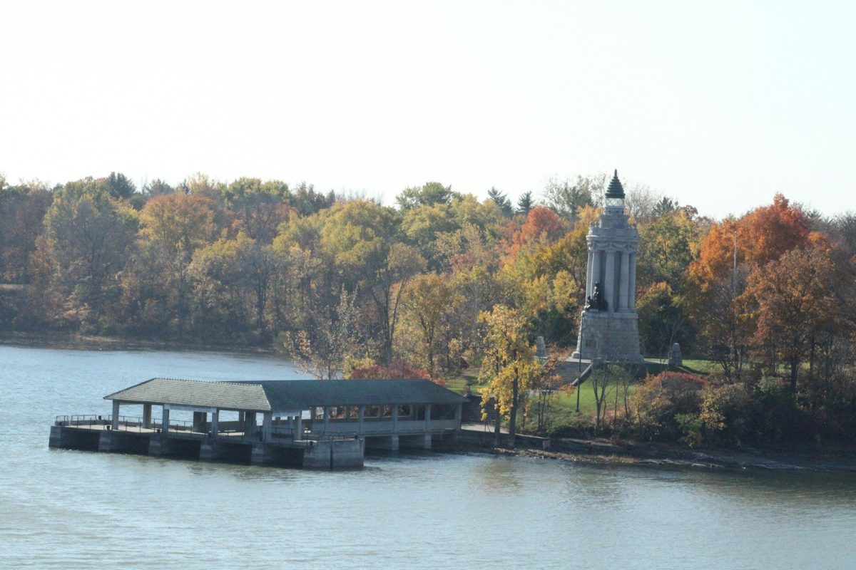 8 Must-Visit Lake Destinations in the U.S. for Summer Travelers 7 a building on a dock by a body of water with trees in the back