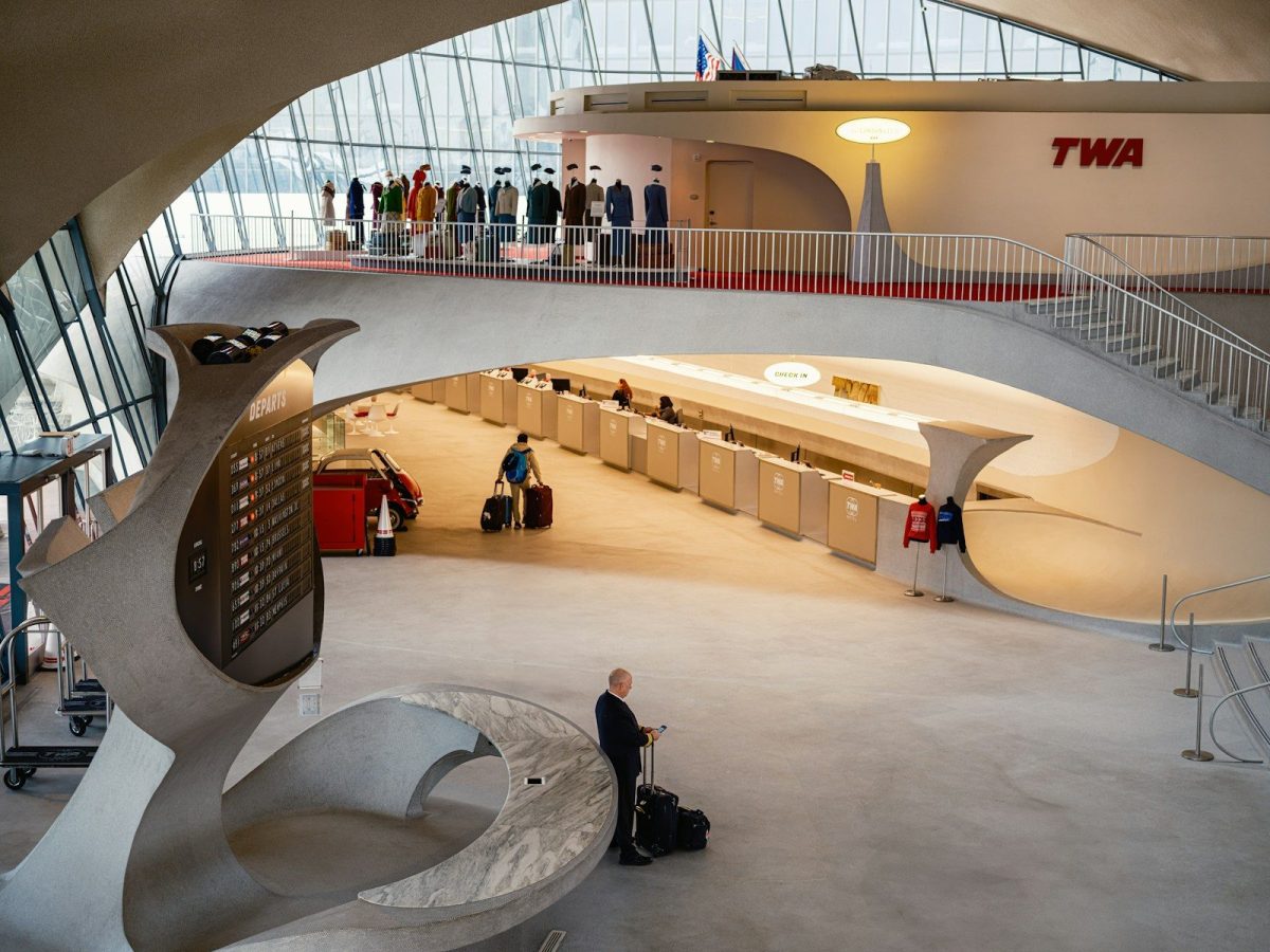 Inside a retro-styled airport terminal.