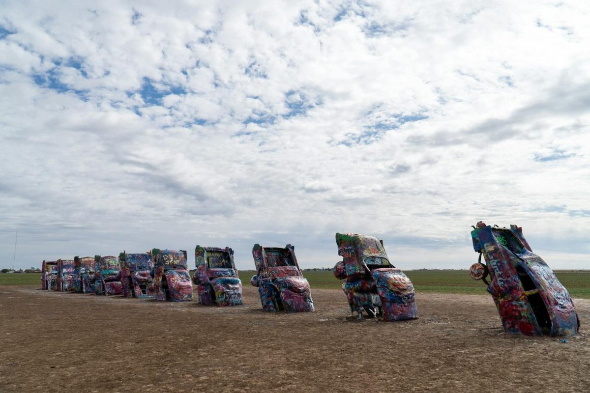 Iconic Cadillac Ranch displaying colorful spray-painted cars in Amarillo, Texas.