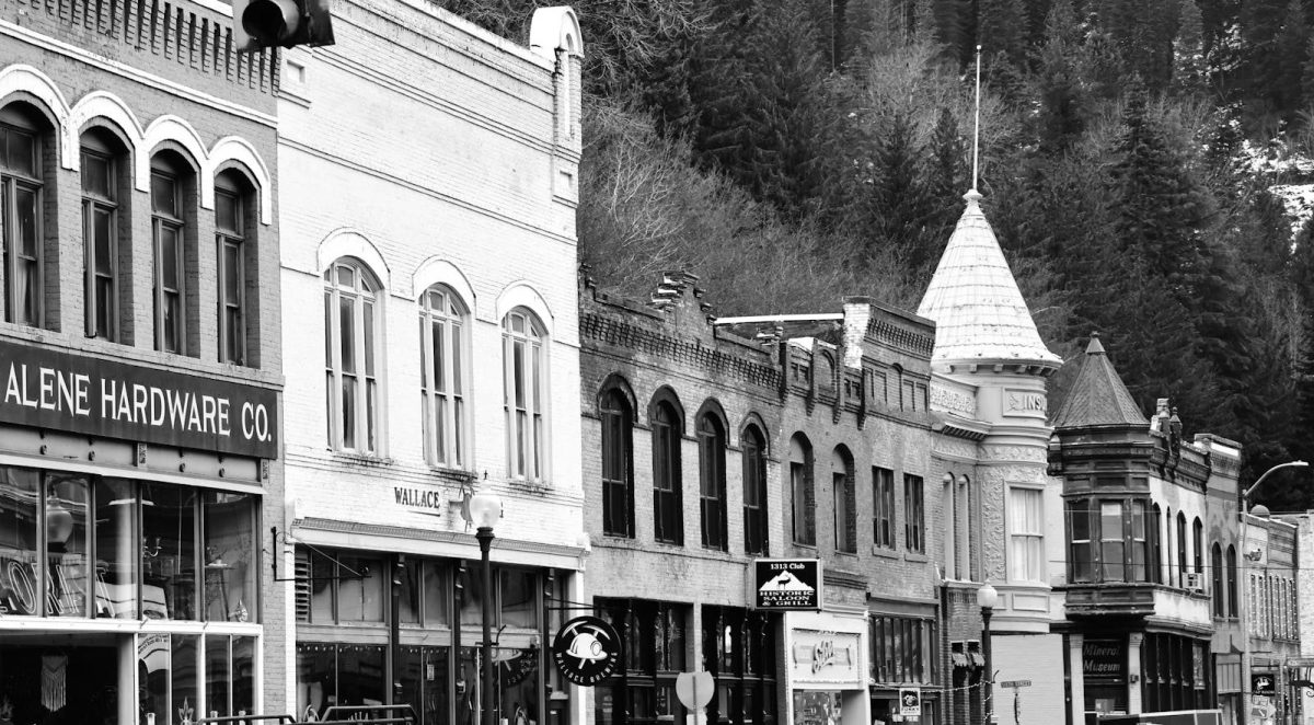 Black and white photo of historic downtown Wallace, Idaho featuring vintage buildings.