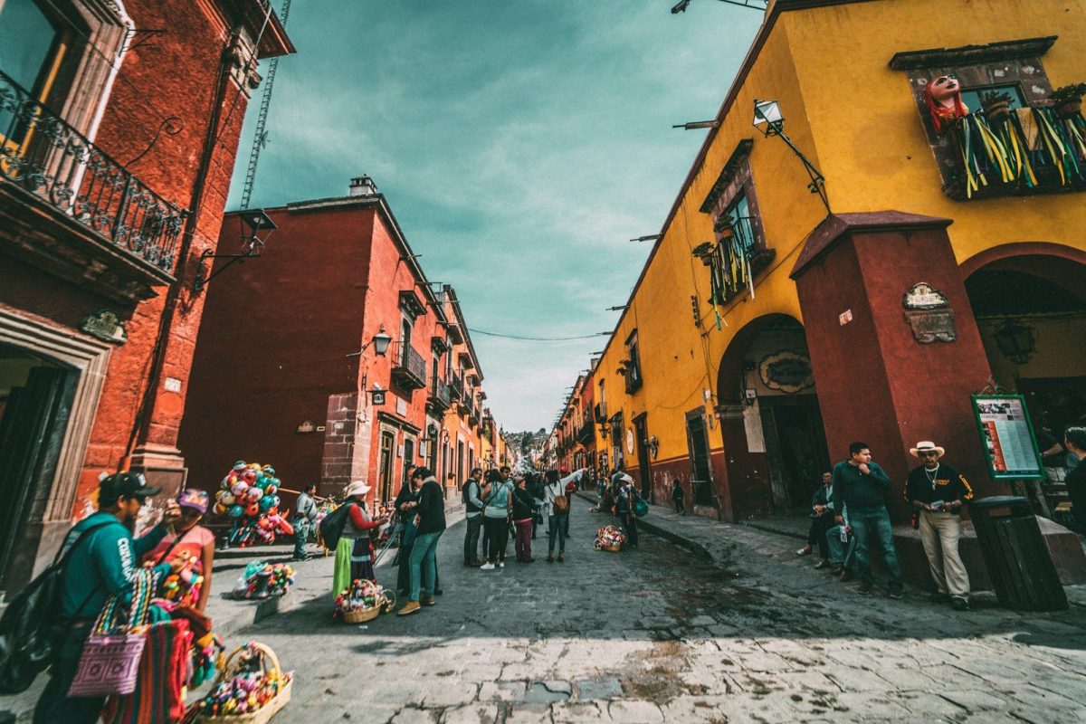 15 Great Places Around the World to Enjoy Retirement 4 people standing on corner road near concrete buildings during daytime