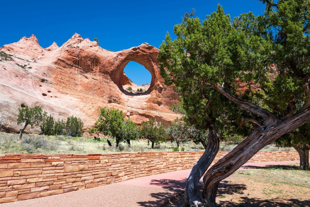 a stone wall with a hole in the middle of it