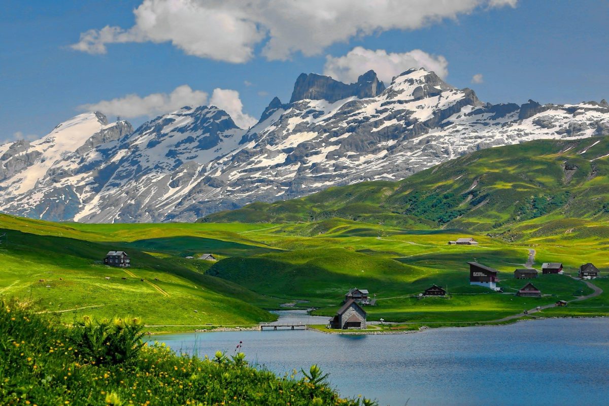 20 Happy Countries Around the World That Are Great for Travelers in 2026 14 mountain and houses