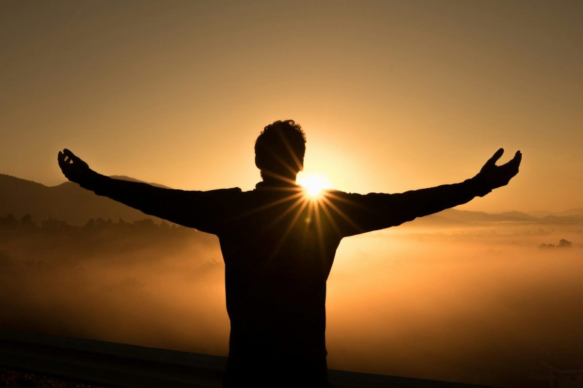 10 Things Travelers Should Know About Life in the USA and Russia 1 silhouette photo of man on cliff during sunset