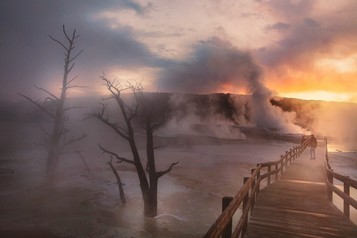 8 Reasons Yellowstone Should Be on Your 2026 Travel List 6 person near geyser