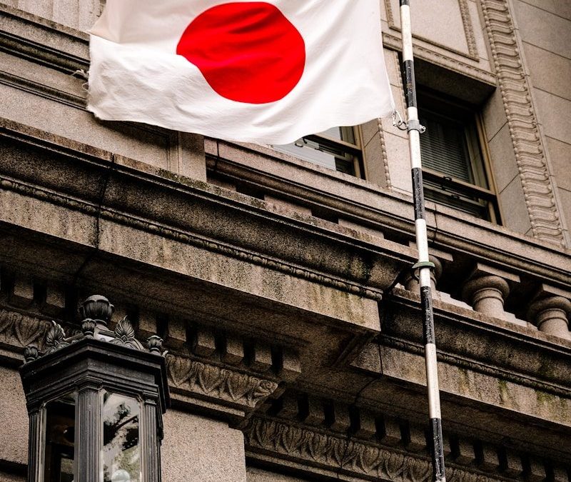 a flag flying in front of a building