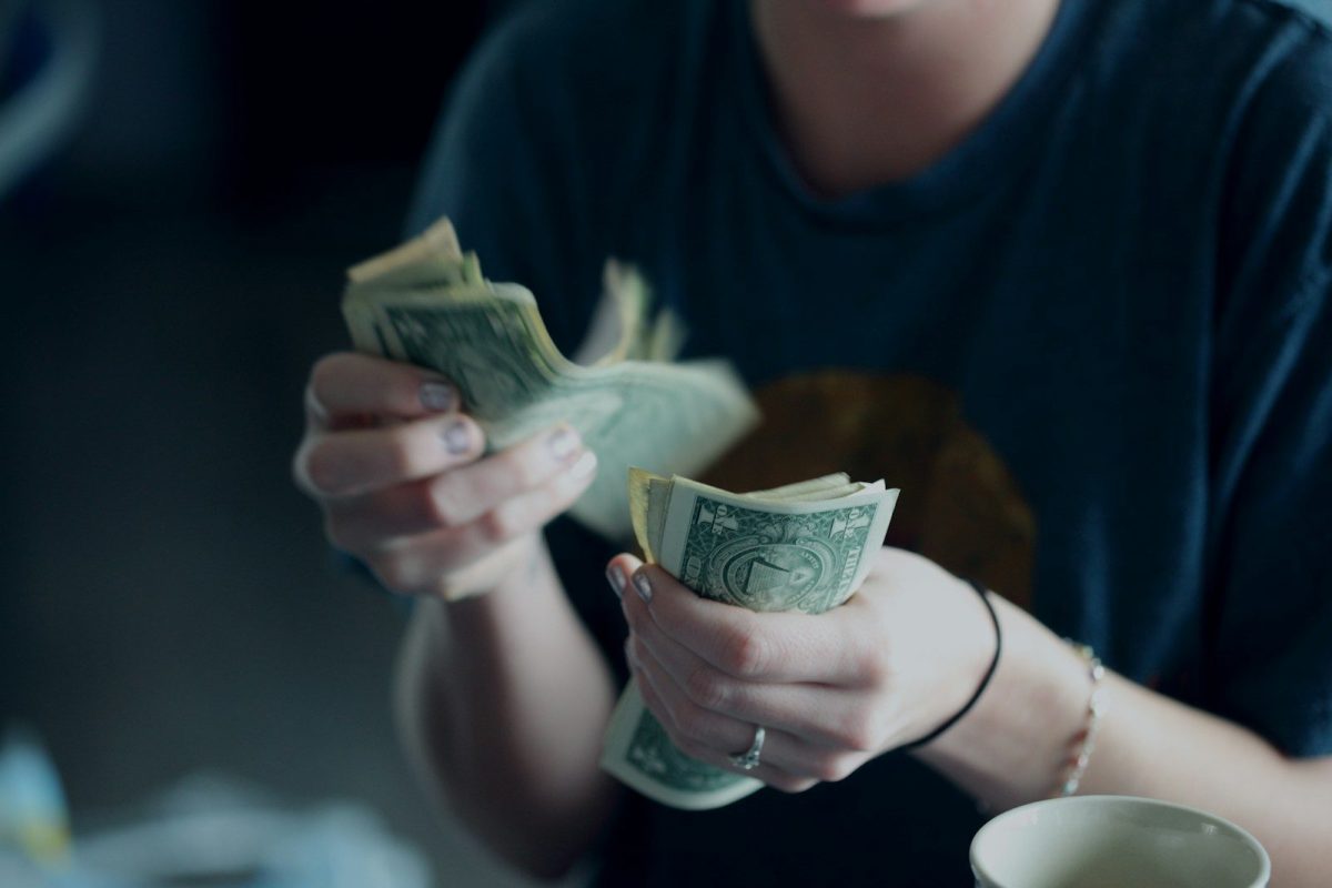 10 Things Travelers Should Know About Life in the USA and Russia 4 focus photography of person counting dollar banknotes