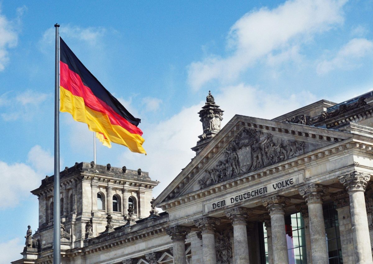 20 Happy Countries Around the World That Are Great for Travelers in 2026 10 white concrete building with flags on top under blue sky during daytime