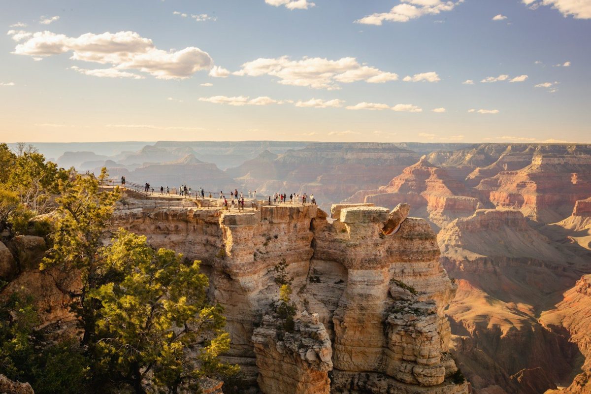 9 Important Things to Know Before Visiting the Grand Canyon 8 a group of people standing on the edge of a cliff