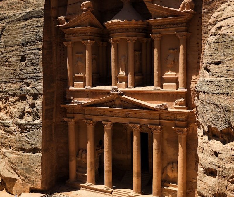 Petra with pillars and people walking around