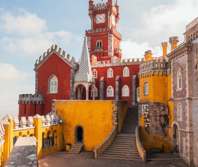 yellow and red concrete building under clear blue sky