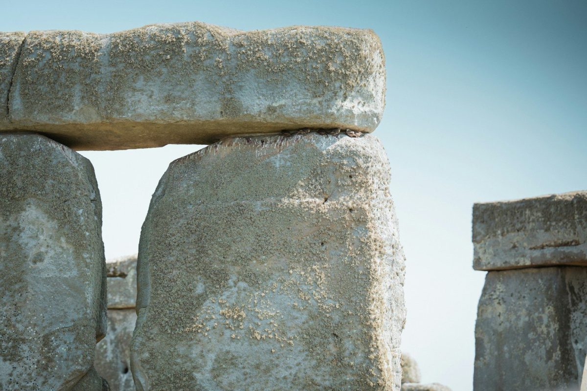 A close up of a stone structure with a sky background