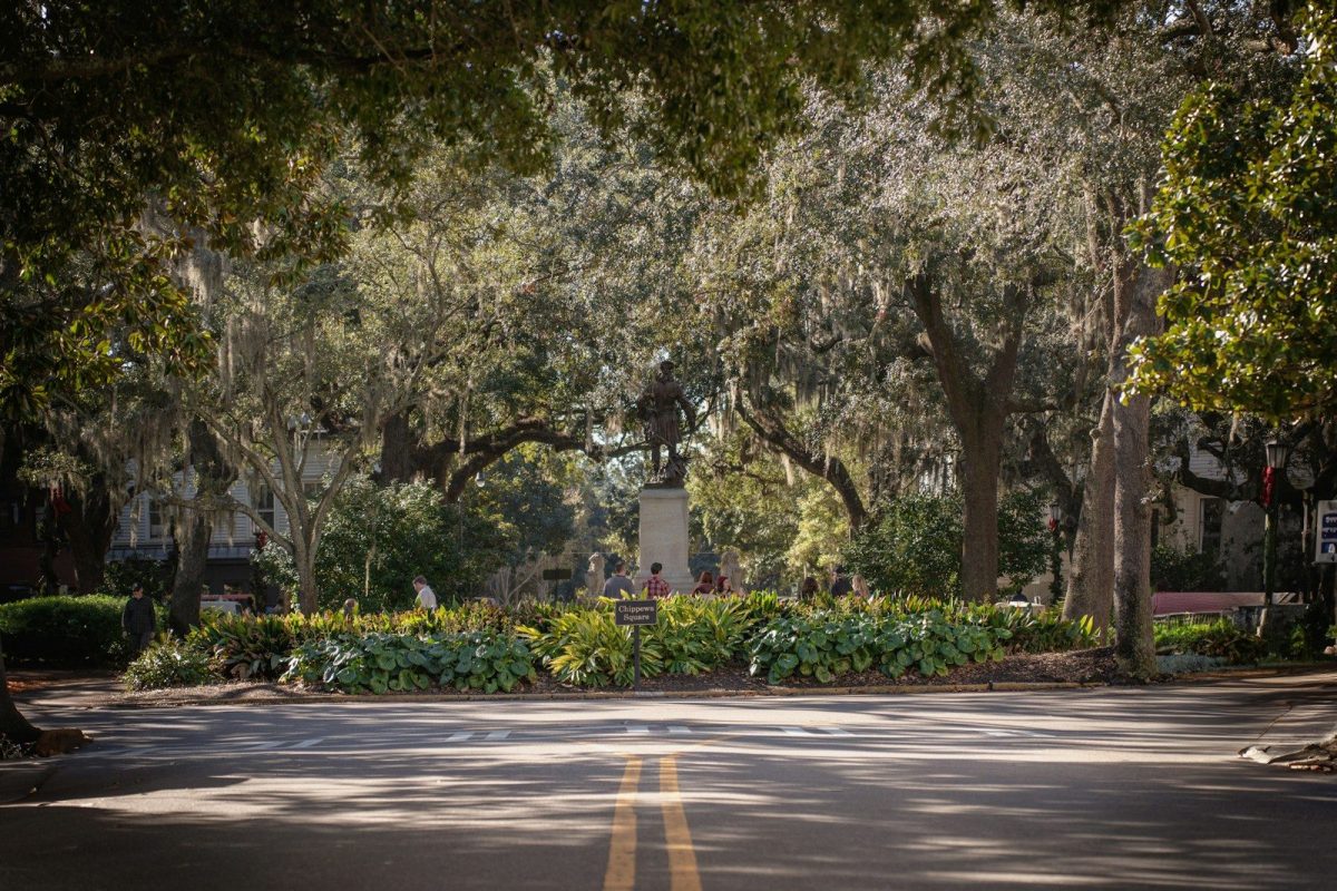 8 of America's Oldest Roadside Stops You Can Still See 4 A street with trees and bushes on both sides of it
