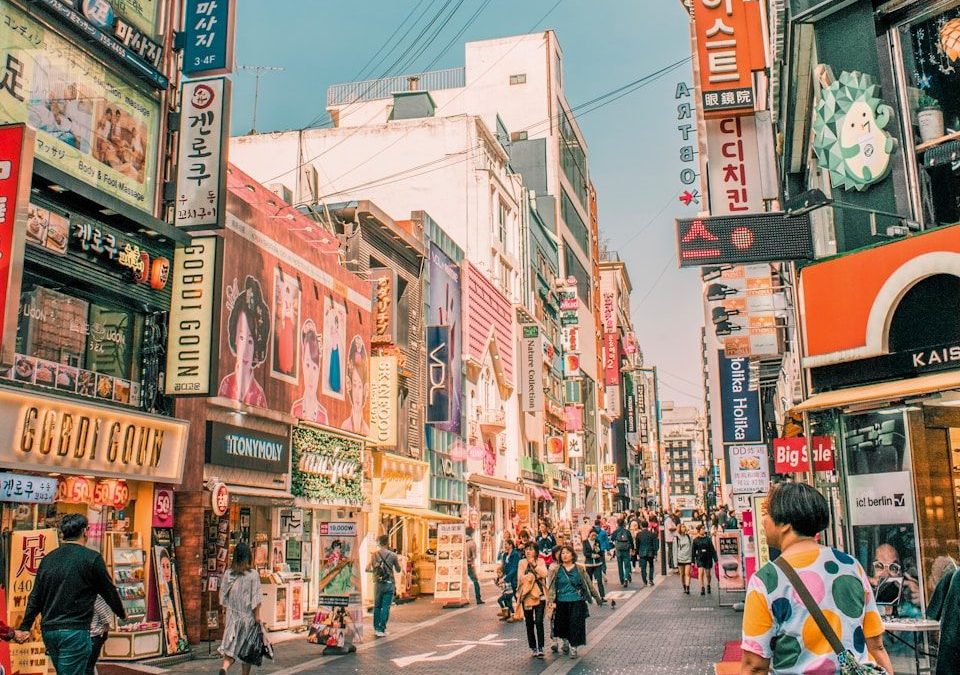 people walking on road surrounded by buildings