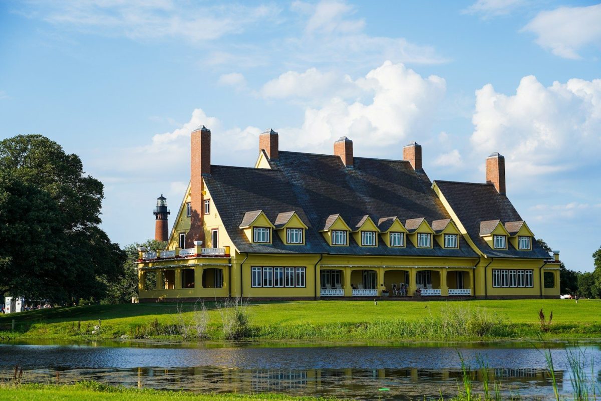 9 Beautiful Lakeside Homes Around the World Worth Seeing 4 brown and white concrete house near river under white clouds during daytime