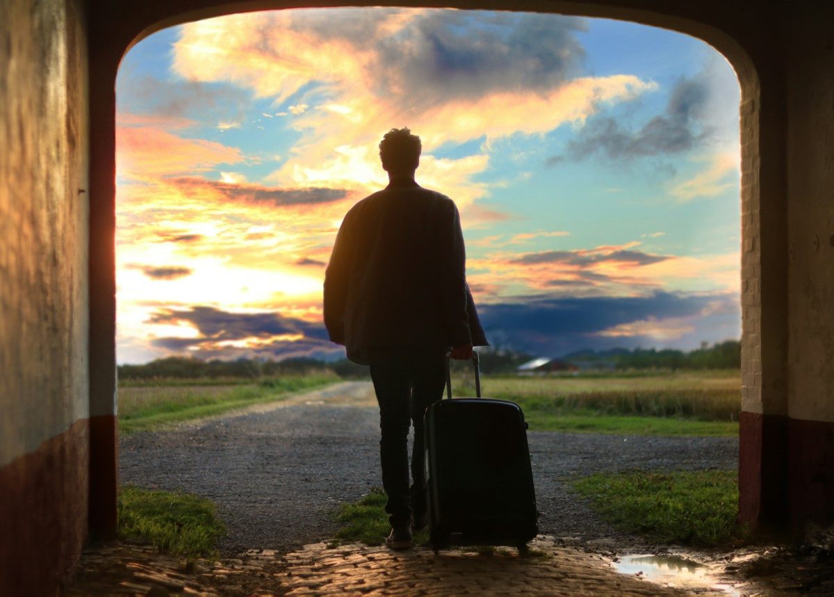 9 Essential Safety Tips for Solo Travelers 8 man holding luggage photo