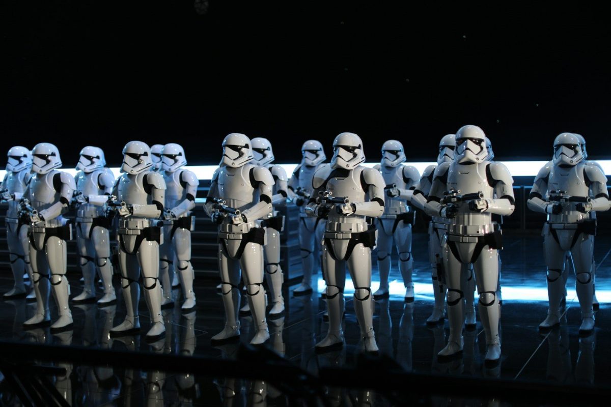 A group of star wars action figures lined up