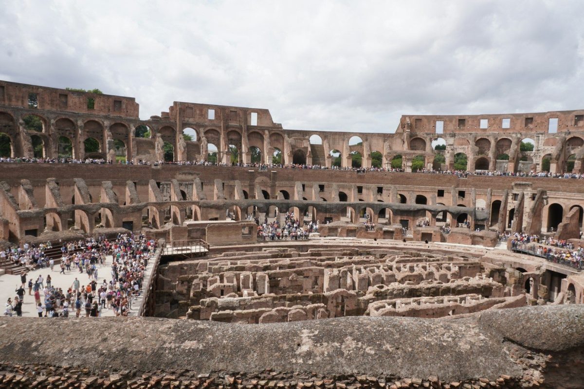 A group of people standing inside of a building
