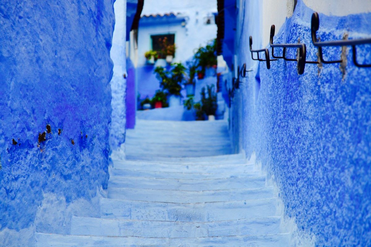 8 Beautiful Streets Around the World to Walk at Least Once 5 a narrow street with blue walls and steps