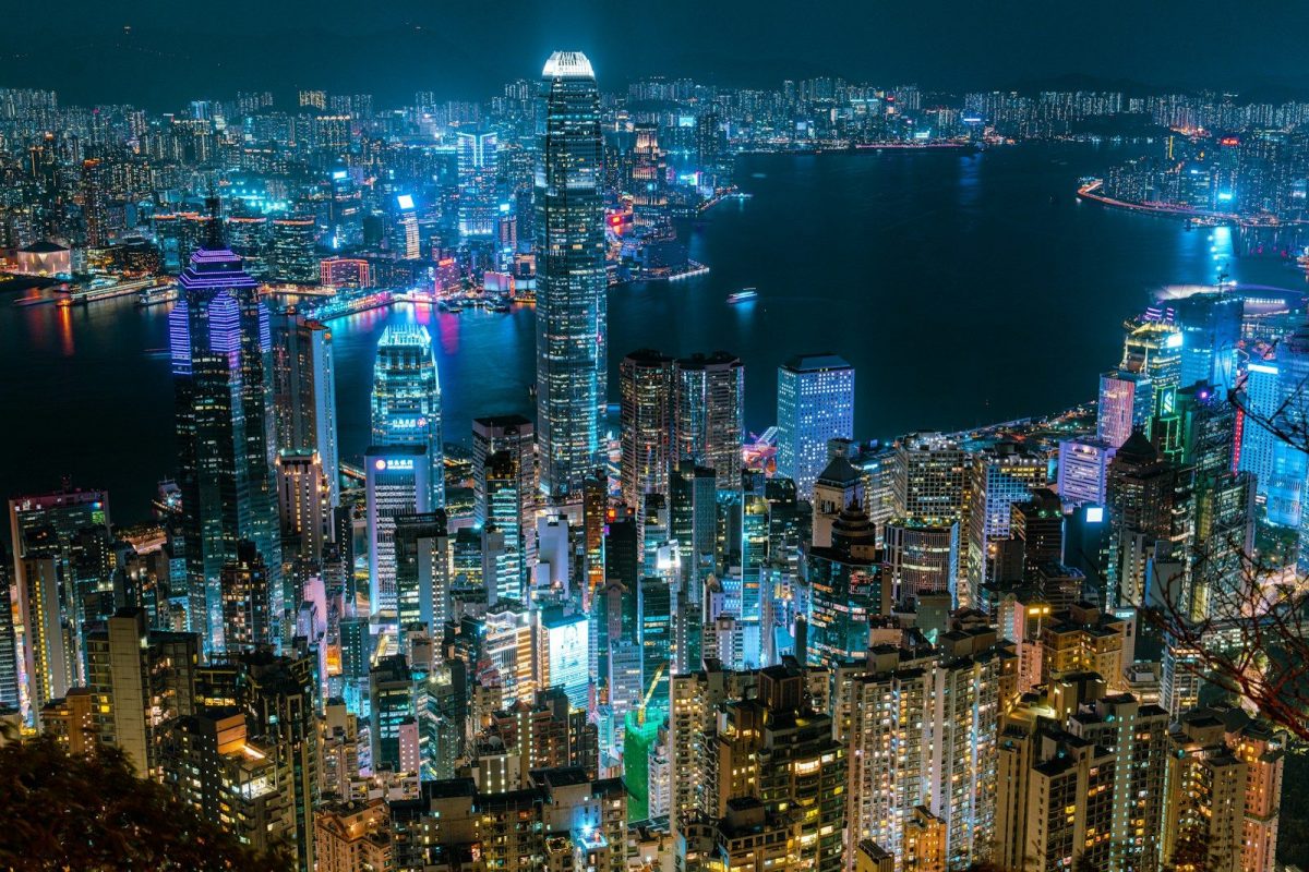 a view of a city at night from the top of a hill