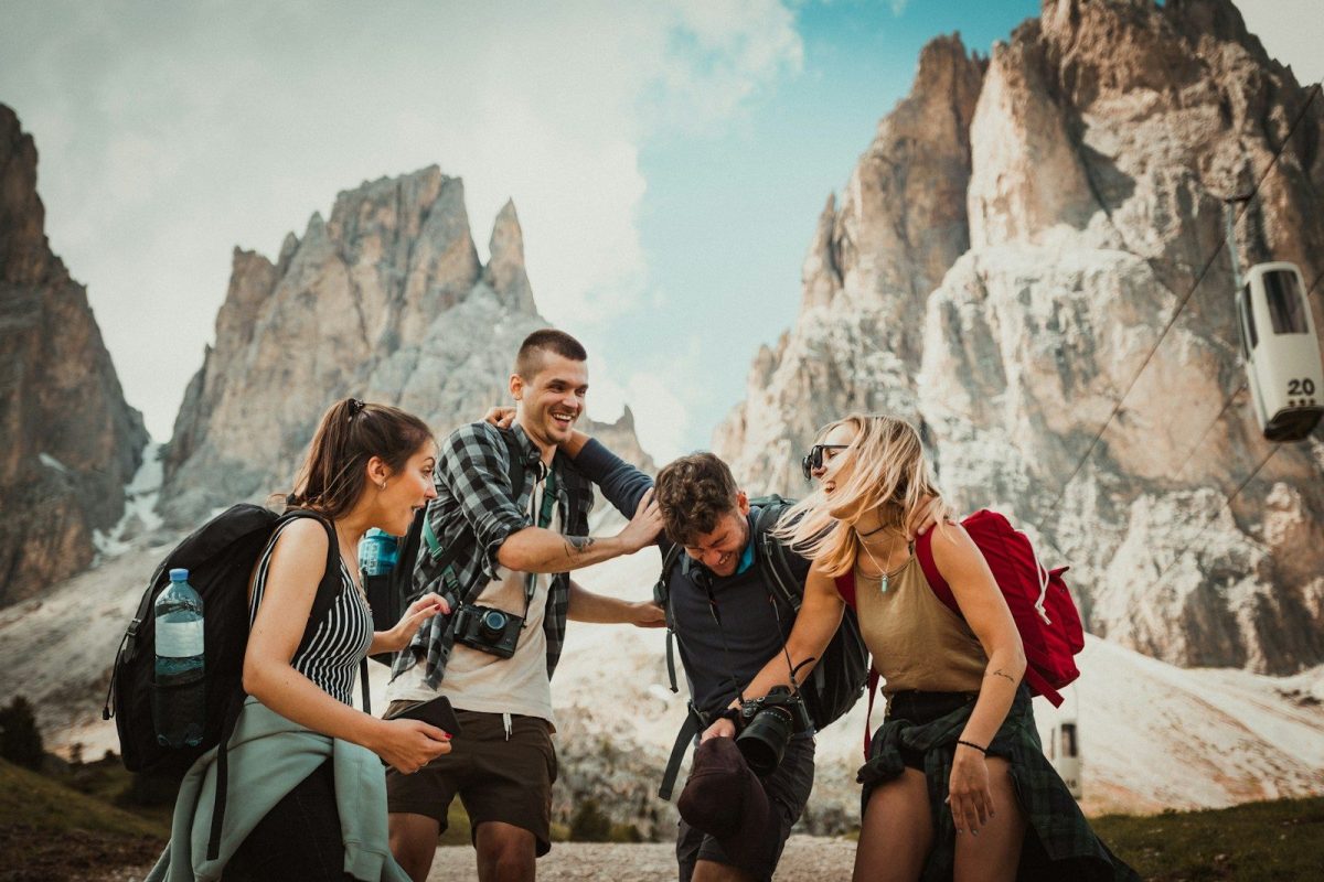 9 Behaviors Locals Hate About Tourists 2 low-angle photography of two men playing beside two women