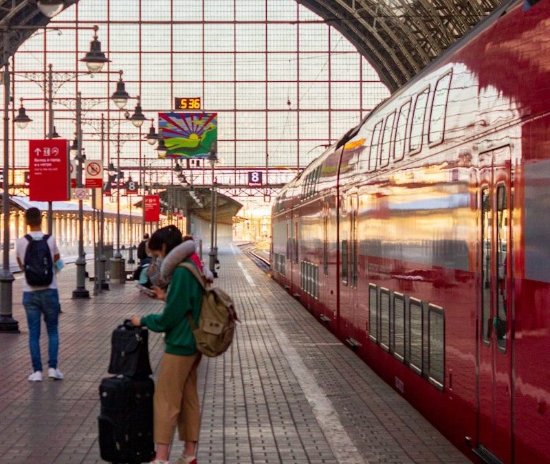 10 Amazing Long Train Trips Around the World for Travelers 7 people walking on train station during daytime