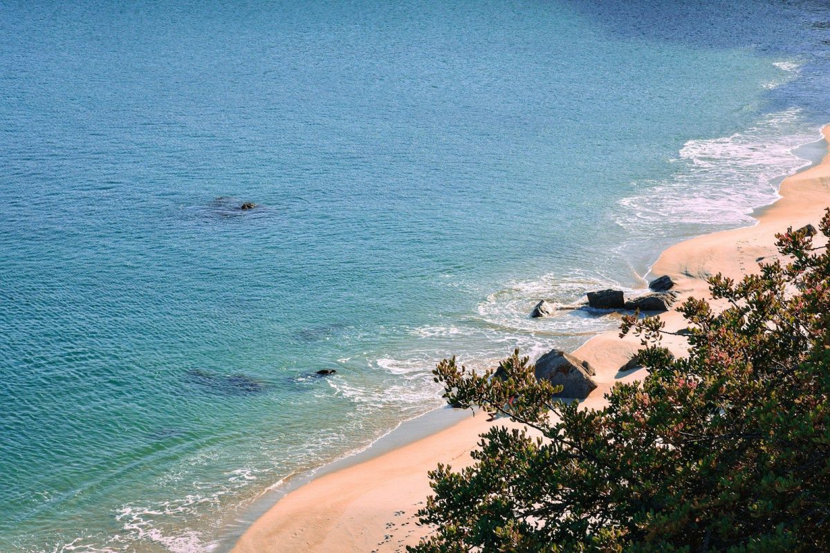 a view of a beach with a boat in the water