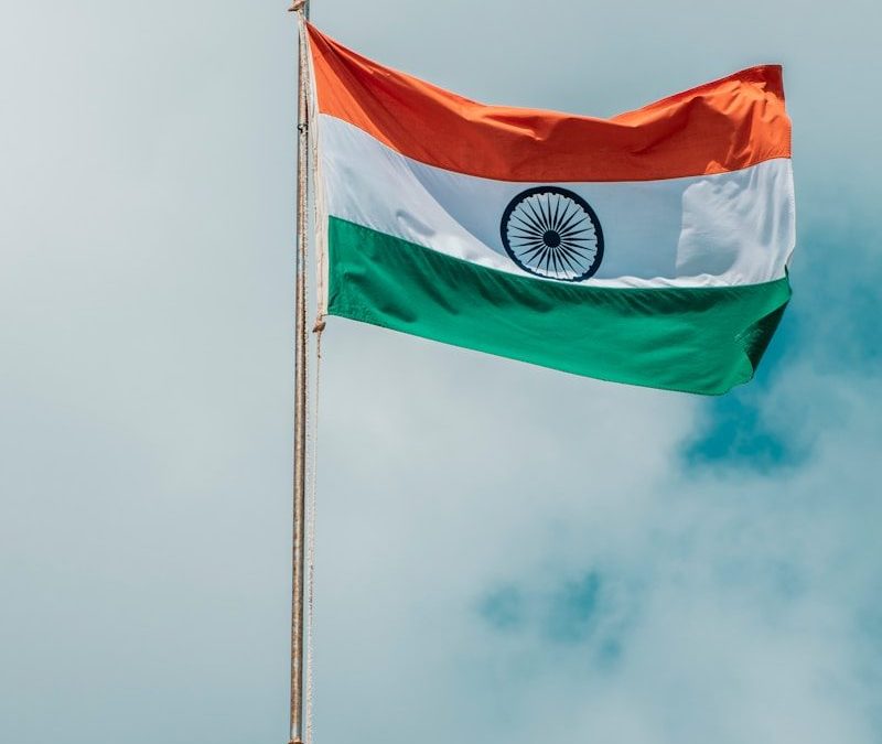 the indian flag is flying high in the sky