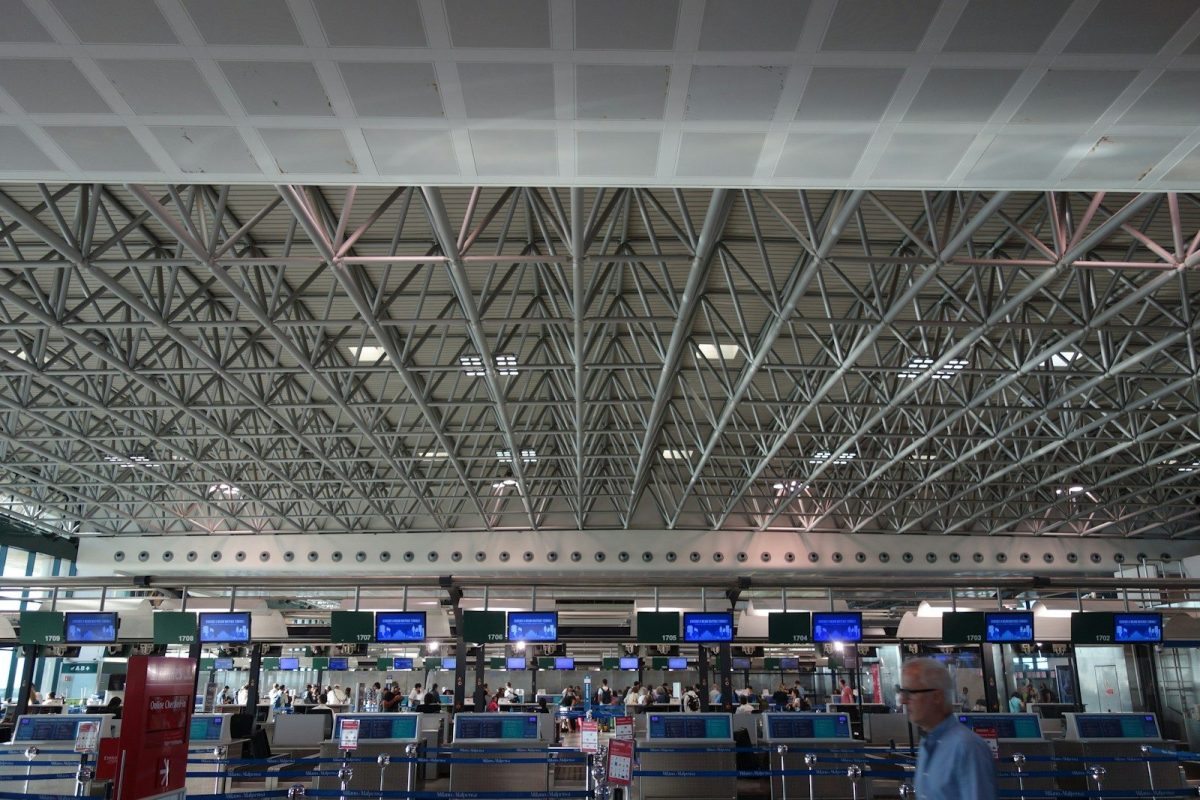 Modern airport check-in counters with electronic displays