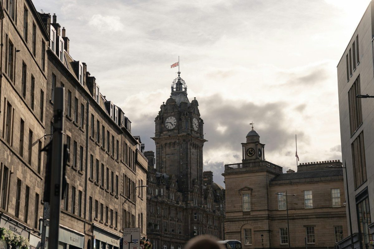 a tall clock tower towering over a city