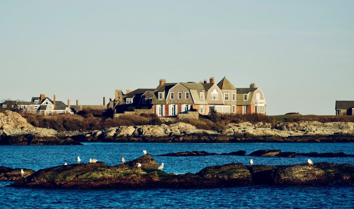 a group of houses on a rocky island