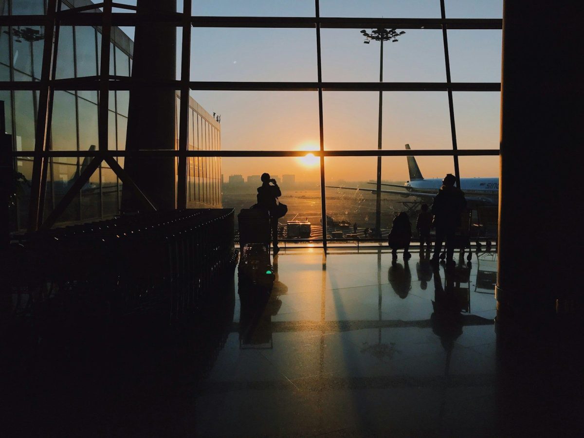 7 Tricks for Finding the Best Airfare Deals in 2026 7 silhouette of people standing inside airport during golden hour