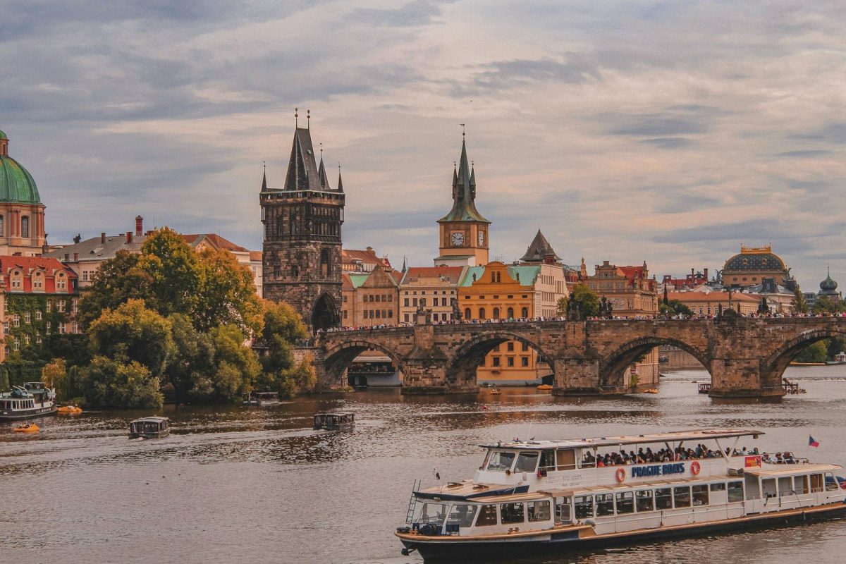 20 Happy Countries Around the World That Are Great for Travelers in 2026 9 white and brown boat on river near brown concrete building during daytime